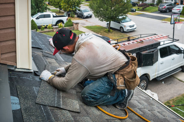 Professional Flat Roof Repair technician working in Elmira, MI